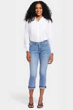 N.Y.D.J Chloe Capri Cuff Jeans. Cropped, women's jeans with button & zip fastening, pockets, shadow cuffs with raw edges and a classic blue denim finish.
