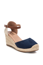 Xti Wedge Sandal. Women's espadrille wedge sandals with a navy, microfibre faux suede upper, a faux leather strap, a 7cm jute wedge and a non-slip rubber sole.