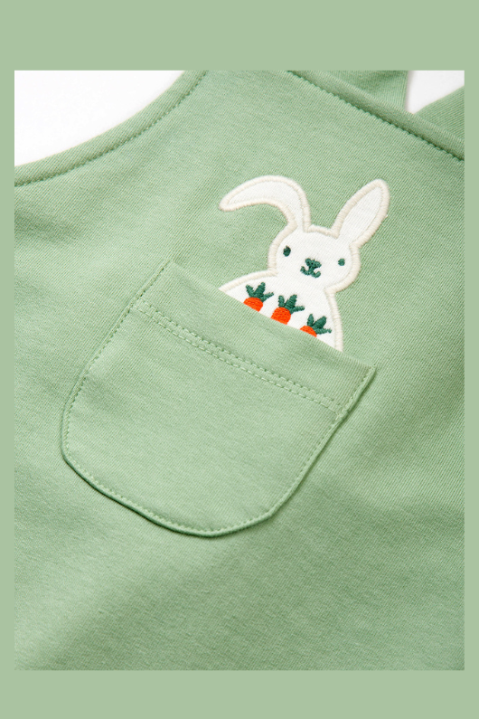 Kite Dungarees. A pair of green dungarees with bunny applique made from stretch fabric.