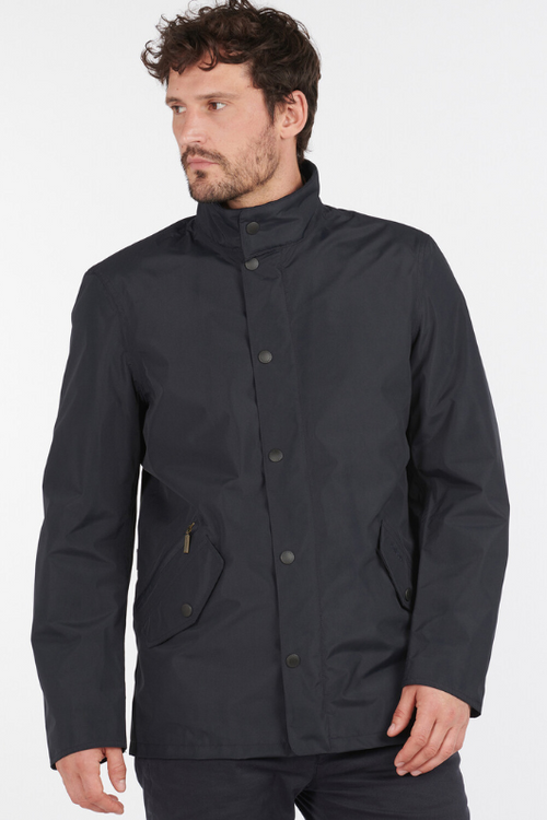 An image of a male model wearing the Barbour Spoonbill Waterproof Jacket in the colour Navy.