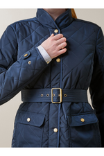 An image of a female model wearing the Ariat Woodside Jacket in the colour Navy.