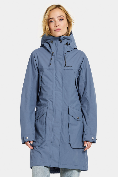 Didriksons Thelma Parka 10. A fully waterproof and windproof jacket with a feminine drawstring waist, pockets, a two-way adjustable hood, and front zip fastening