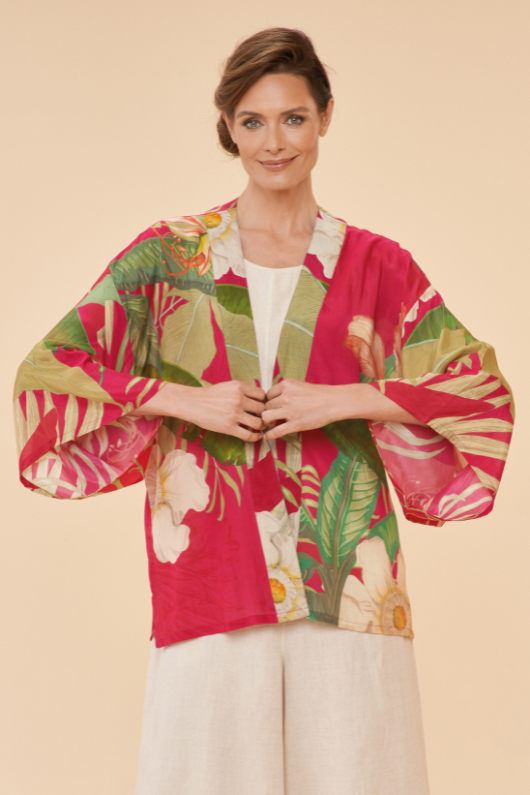 Powder Tropical Kimono Jacket. A hip-length, lightweight jacket with kimono-style sleeves in a red tropical print