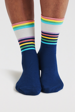 An image of the Though Clara Rainbow Stripe Socks in the colour Indigo Blue.