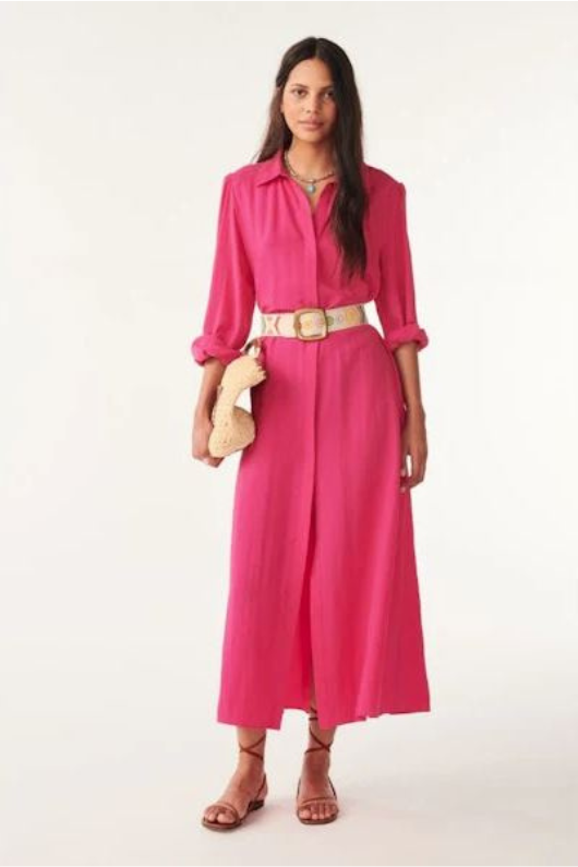 An image of a female model wearing the BA&SH Lara Shirt Dress in the colour Fuchsia.