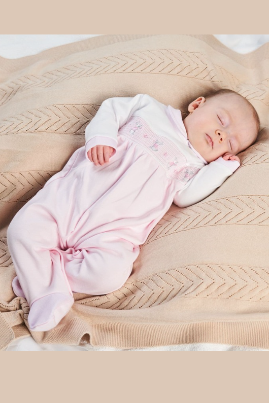 An image of the Dandelion Clothing Bunny & Flower Smocked Sleepsuit