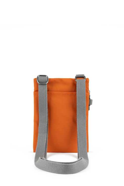 An image of the Roka London Chelsea Burnt Orange Recycled Nylon Crossbody Bag.