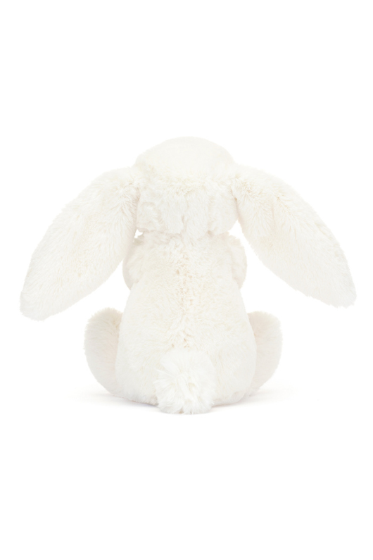 Jellycat Bashful Bunny With Carrot Little. A soft toy white bunny holding an orange tufty carrot.