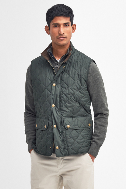 An image of a male model wearing the Barbour Lowerdale Gilet in the colour Sage.