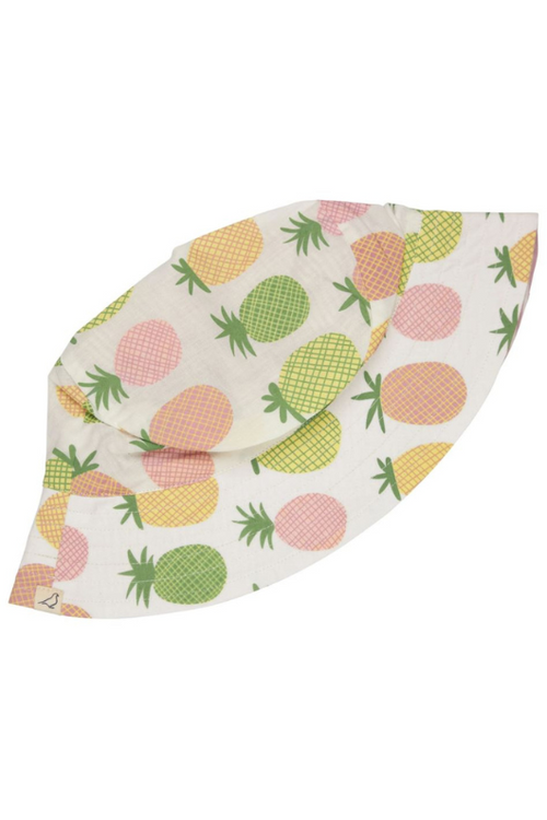 Pigeon Organics Reversible Sunhat. A sun hat with pink and green pineapple print on one side and stripe print on the reverse.