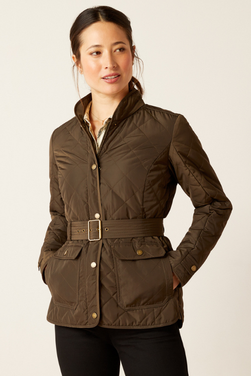 An image of a female model wearing the Ariat Woodside Jacket in the colour Earth.