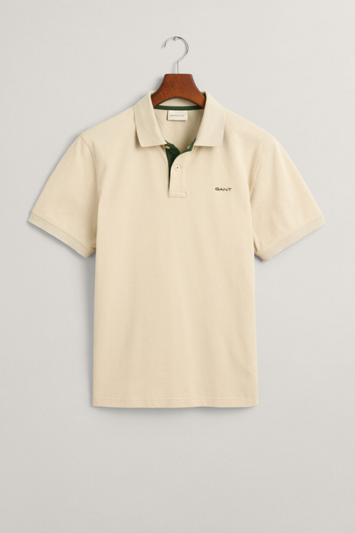 Gant Contrast Pique Polo Shirt. A regular fit men's polo shirt with a flat knit collar, contrast colour detail and a silky beige finish