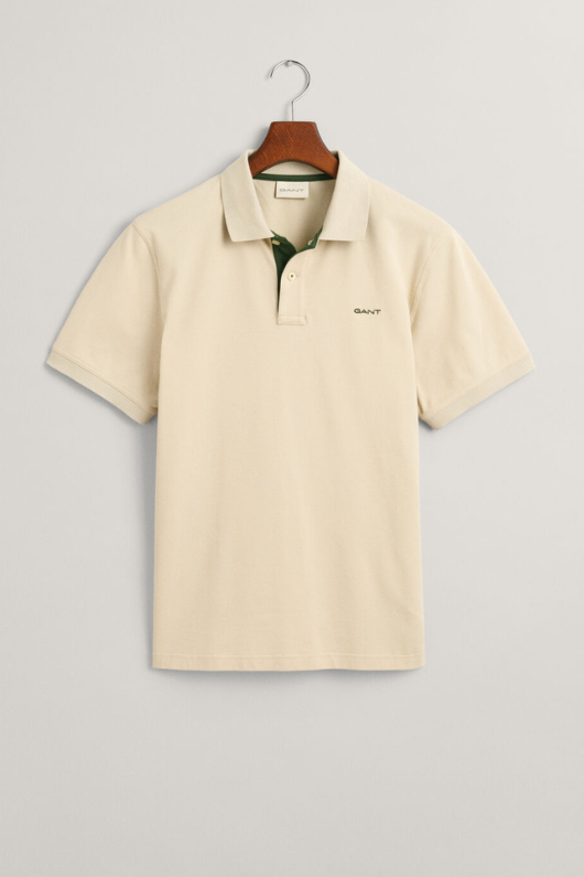 Gant Contrast Pique Polo Shirt. A regular fit men's polo shirt with a flat knit collar, contrast colour detail and a silky beige finish