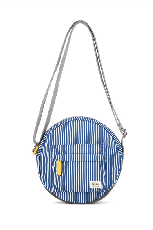 An image of the Roka London Paddington B Hickory Stripe Recycled Canvas Crossbody Bag.