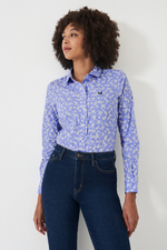 An image of a female model wearing the Crew Clothing Lulworth Shirt in the colour Blue Floral Print.