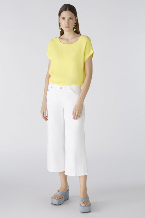 Oui Plain Cap Sleeve T-Shirt. A yellow top with short sleeves, wide neck, and split hem.