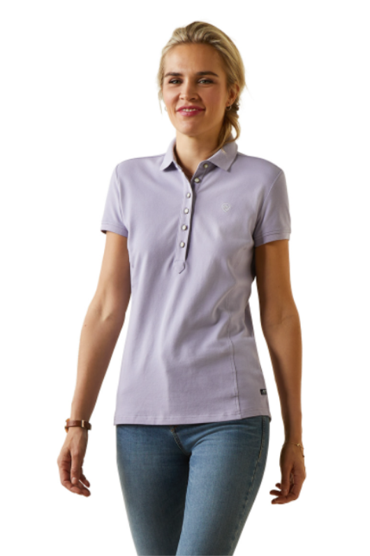 An image of a female model wearing the Ariat Prix 2.0 Polo Shirt in the colour Lilac.