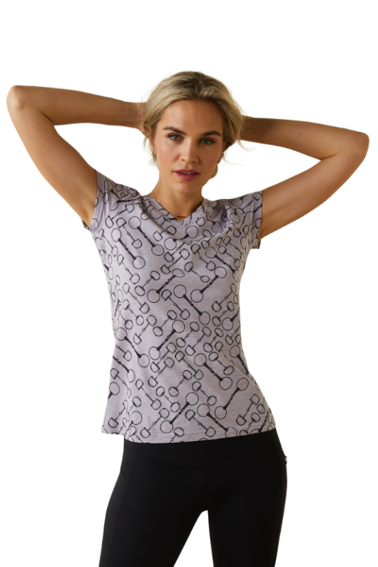 An image of a female model wearing the Ariat Snaffle Short Sleeve T-Shirt in the colour Lavender.