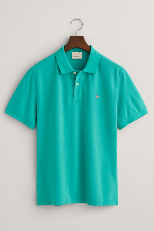 An image of the Gant Men's Regular Fit Shield Pique Polo Shirt in the colour Lagoon Blue.