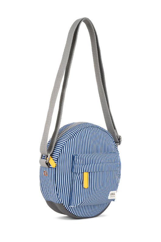 An image of the Roka London Paddington B Hickory Stripe Recycled Canvas Crossbody Bag.