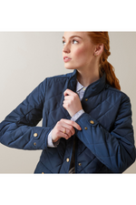 An image of a female model wearing the Ariat Woodside Jacket in the colour Navy.