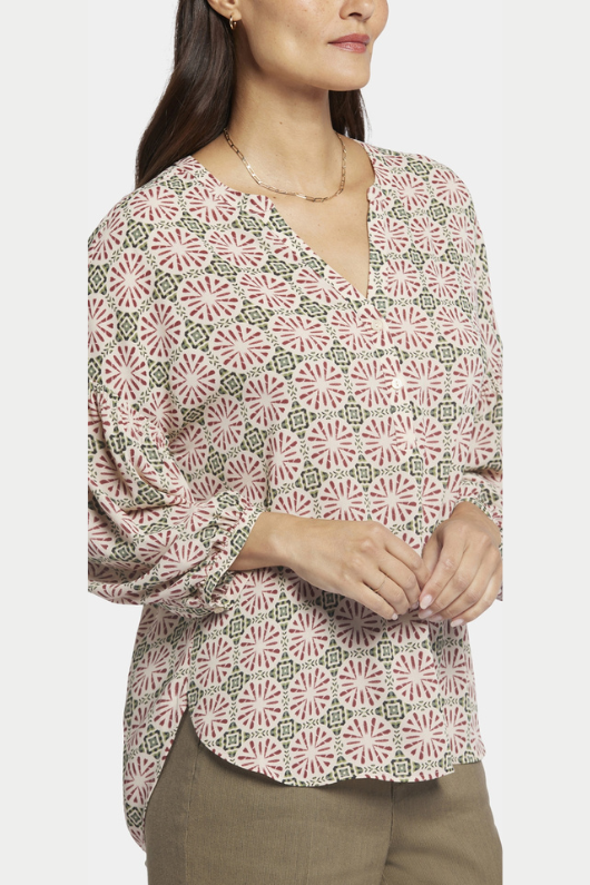 An image of a female model wearing the NYDJ Paulina Peasant Blouse in the colour Green Multi.