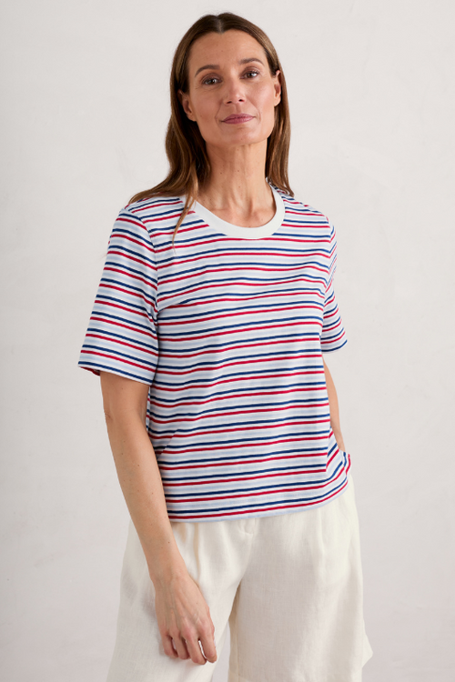 An image of a female model wearing the Seasalt Copseland Striped Organic Cotton T-Shirt in the colour Tri Pellitras Chalk Relish.