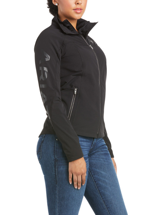 An image of a female model wearing the Ariat Agile Softshell Jacket in the colour Black.