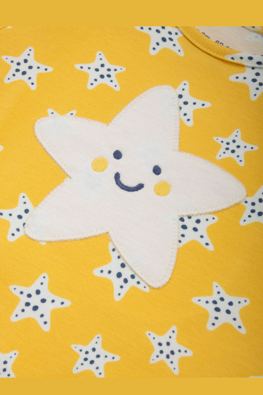 Kite Romper. A short sleeve, short leg romper with yellow starfish print.