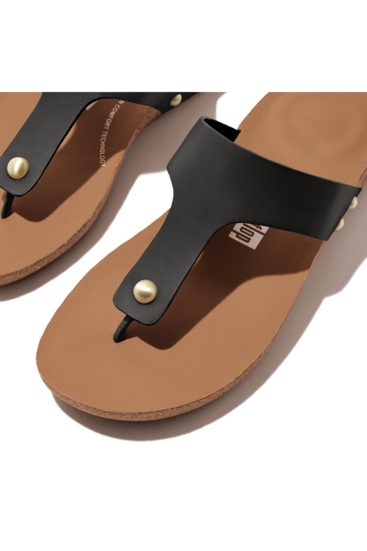 Fitflop iQushion Leather Toe Post Sandal. A pair of lightweight sandals wish cushioned sole, arch support, black leather T-bar design featuring metal studs, and cork sole.