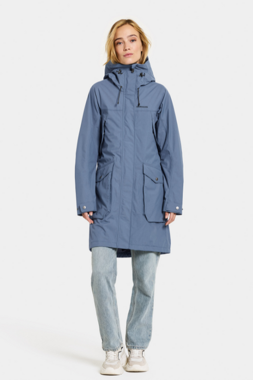 Didriksons Thelma Parka 10. A fully waterproof and windproof jacket with a feminine drawstring waist, pockets, a two-way adjustable hood, and front zip fastening