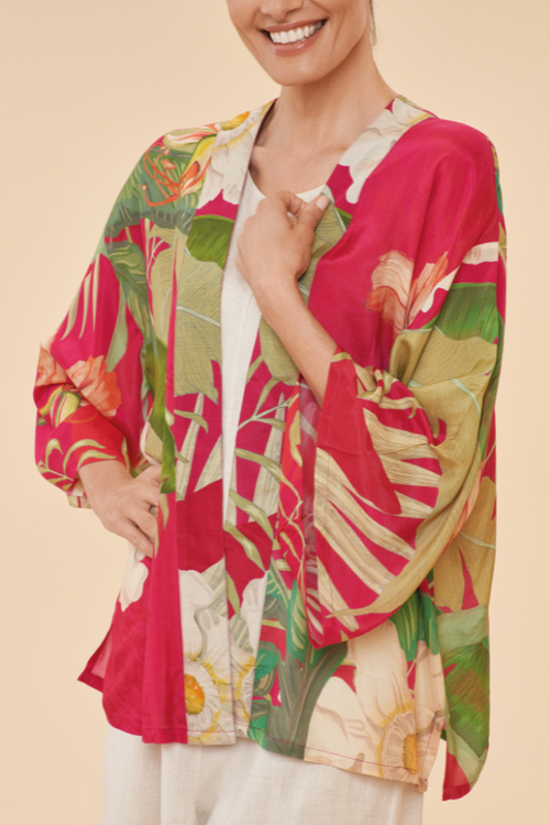 Powder Tropical Kimono Jacket. A hip-length, lightweight jacket with kimono-style sleeves in a red tropical print