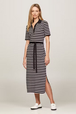 An image of a female model wearing the Tommy Hilfiger Breton Stripe Midi Polo Dress in the colour Black/Calico.