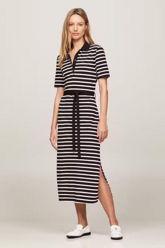 An image of a female model wearing the Tommy Hilfiger Breton Stripe Midi Polo Dress in the colour Black/Calico.