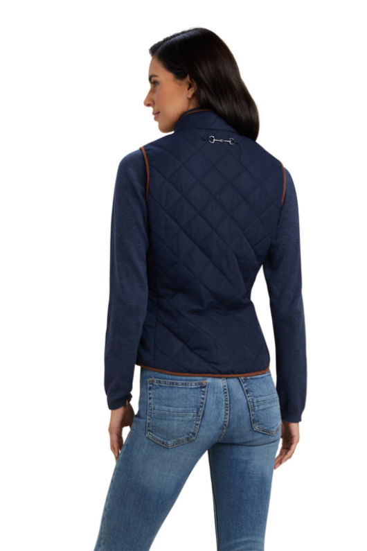 An image of a female model wearing the Ariat Woodside 2.0 Quilted Gilet in the colour Navy.