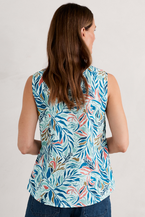 An image of a female model wearing the Seasalt Cobbs Well Sleeveless Top in the colour Kelp Forest Chalk.
