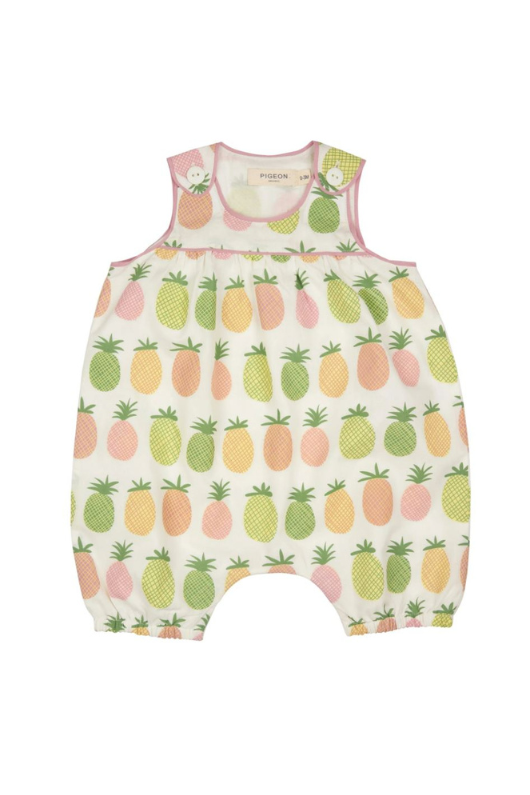 Pigeon Organics Baby Playsuit. This playsuit is sleeveless with buttons on the shoulders, convenient poppers and a cute pink and multicoloured pineapple pattern.