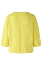 Oui 3/4 Sleeve Jumper. A yellow boxy fit jumper with 3/4 length sleeves, V-neckline, and split hem.