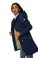 An image of a female model wearing the Ariat Atherton H20 Jacket in the colour Navy.