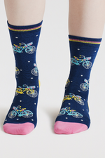 An image of the Thought Rosette Bike Socks in the colour Indigo Blue.