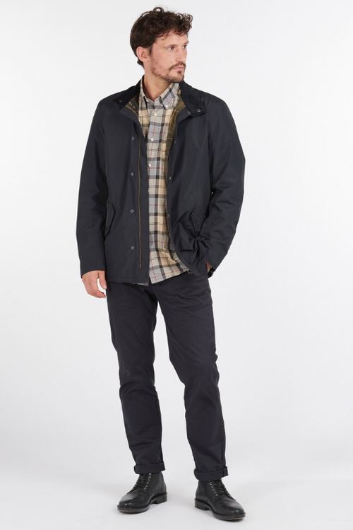 An image of a male model wearing the Barbour Spoonbill Waterproof Jacket in the colour Navy.