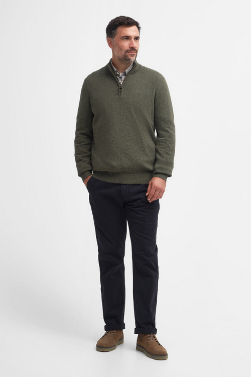 An image of a male model wearing the Barbour Whitfield Half-Zip Jumper in the colour Olive.