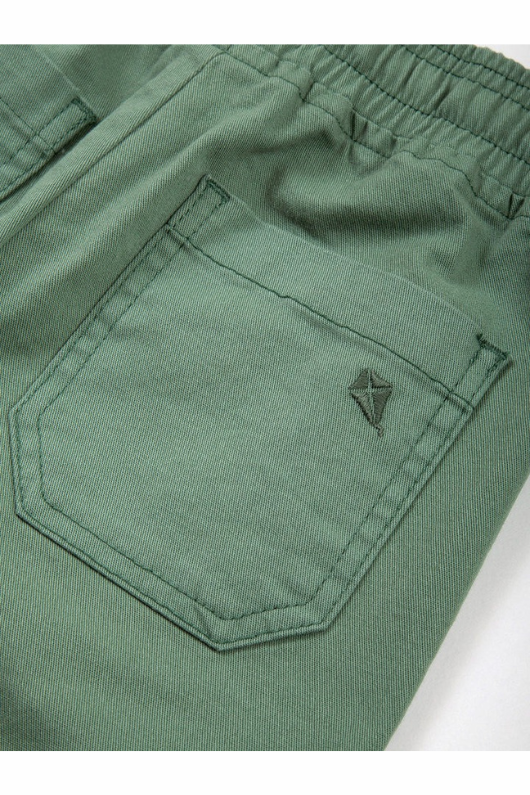 Kite Shorts Sage. A pair of sage green shorts with elasticated waistband, adjustable ties and pockets.