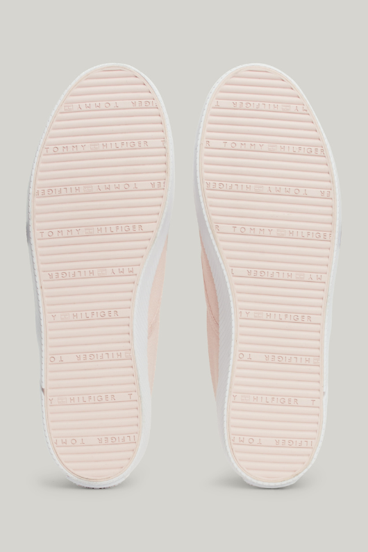 An image of the Tommy Hilfiger Enamel Flag Slip-On Canvas Trainers