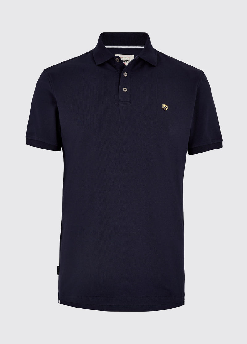 Dubarry Quinlan Polo Shirt. A short sleeve polo with collar, button fastenings, logo embroidery, and anti microbial/UPF 40 finish. Navy.