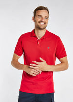 Dubarry Quinlan Polo Shirt. A short sleeve polo with collar, button fastenings, logo embroidery, and anti microbial/UPF 40 finish. Engine Red.