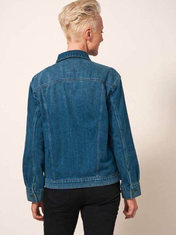White Stuff Dayton Denim Cotton Jacket. A women's denim jacket in a classic fit with a collar, button fastening, and a timeless blue denim finish.