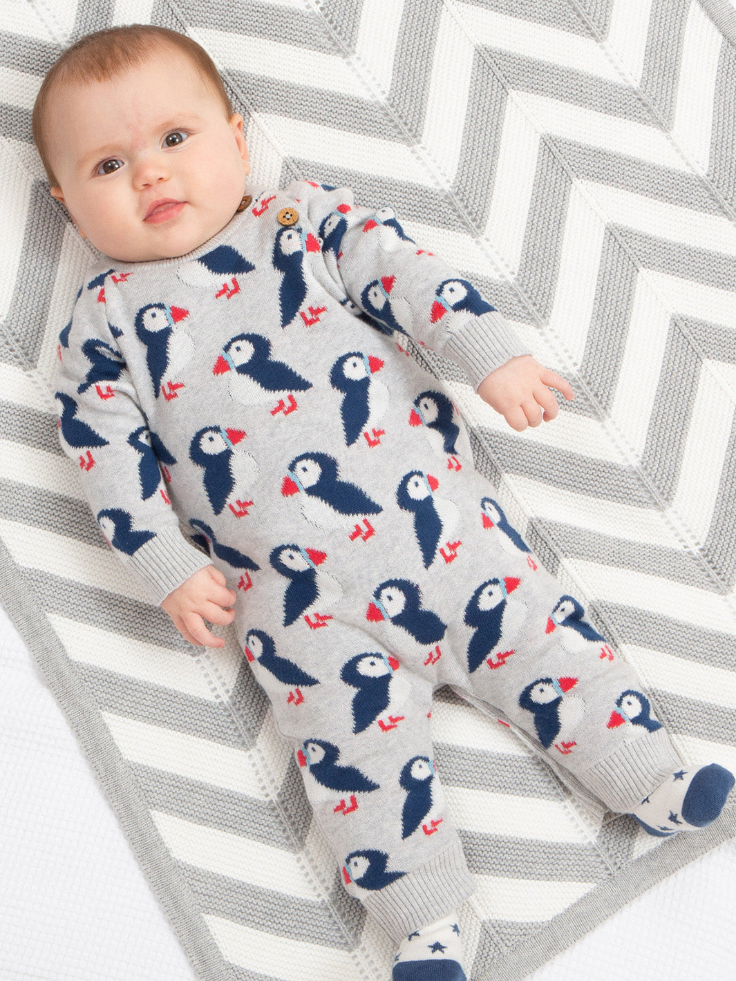 An image of the Kite Puffin Knit Romper