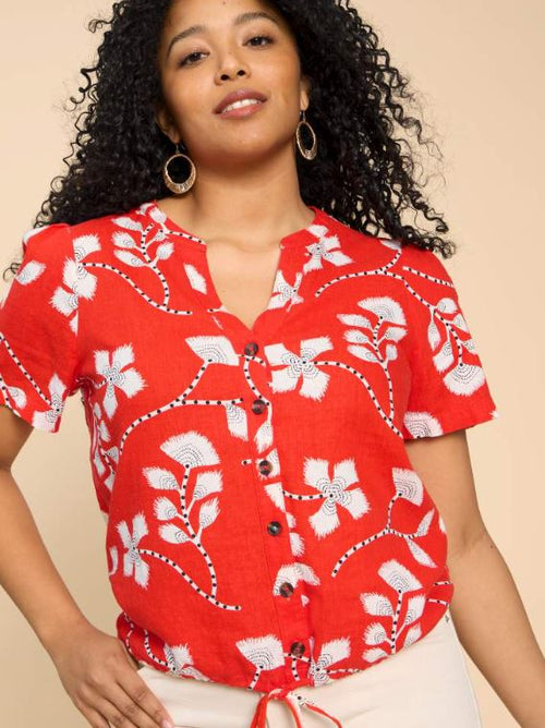 White Stuff Ferne Linen Blend Shirt. A relaxed fit top with short sleeves and notch neck in a bold red and white floral print.