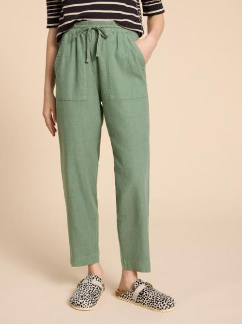 White Stuff Elle Linen Blend Trouser. Relaxed-fit, women's trousers with a tie-waist, ankle length, pockets, and a super comfy finish.